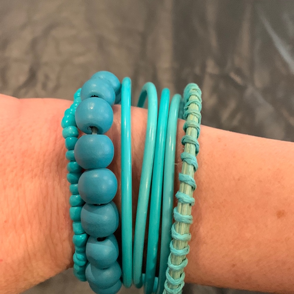 Costume set of 7 teal colored bracelets